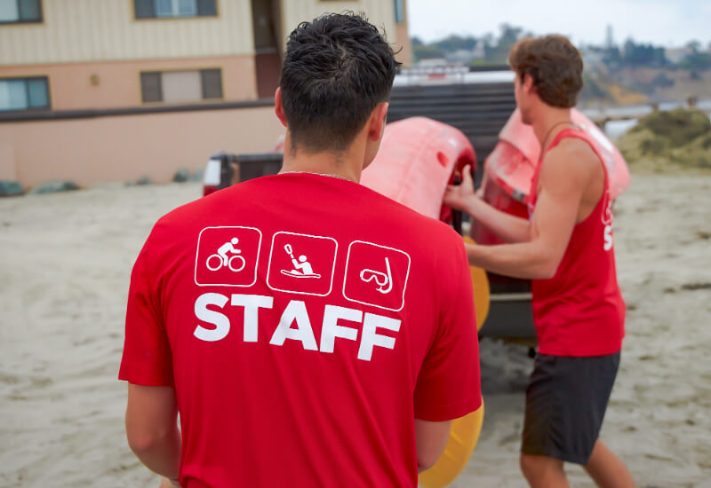 bike and kayak guides transporting kayaks to la jolla shores