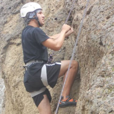 person rock climbing